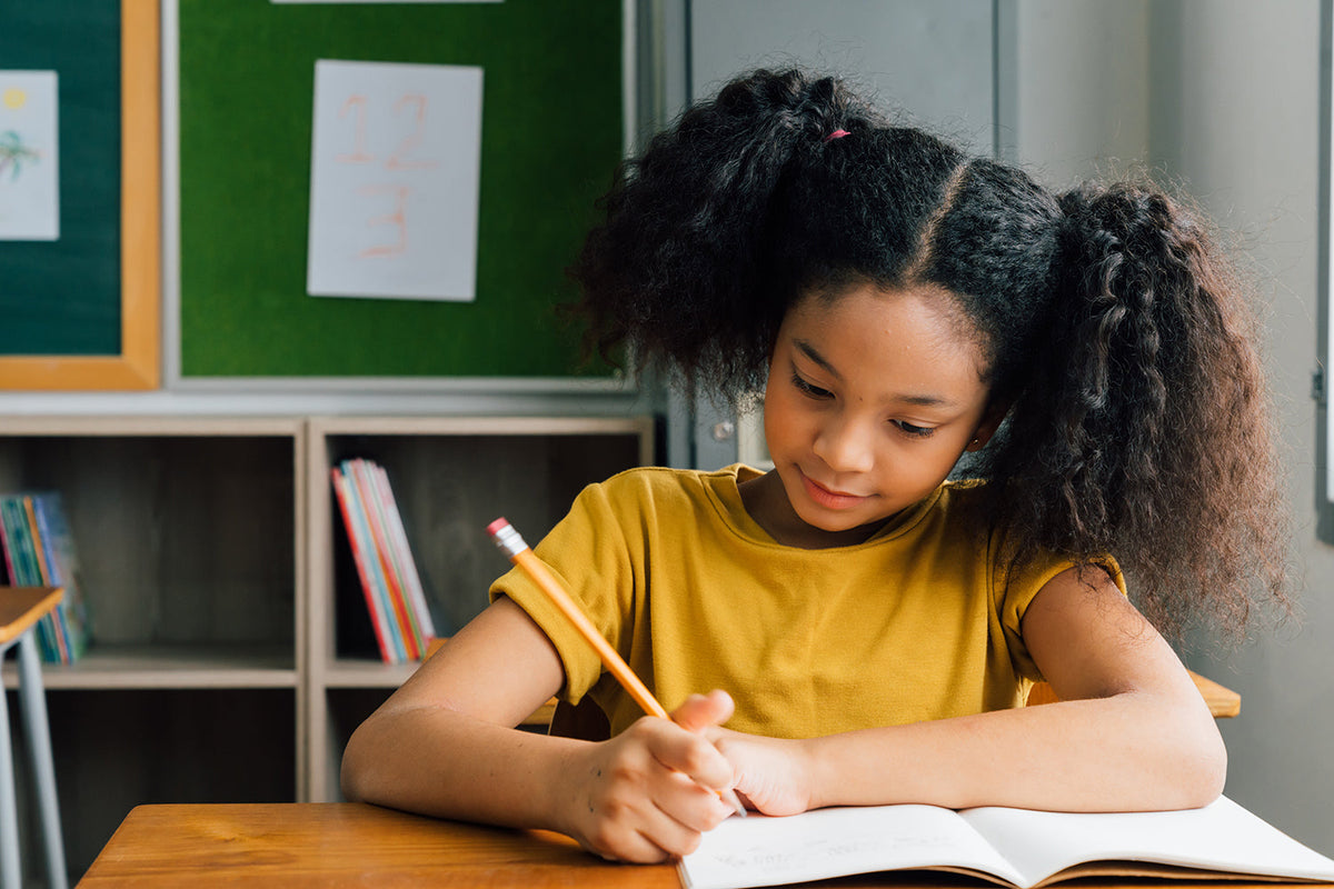 young child doing school work